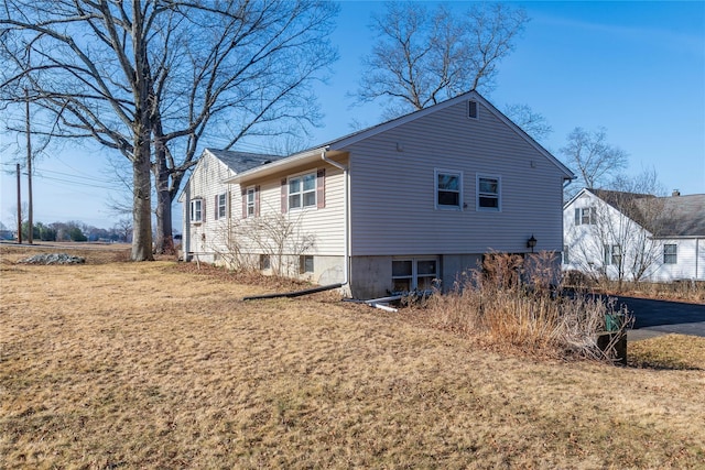 rear view of house with a lawn