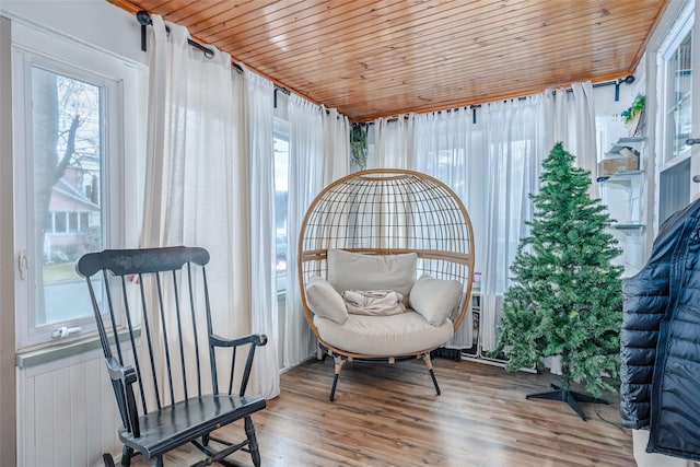 sitting room featuring wooden ceiling and wood finished floors