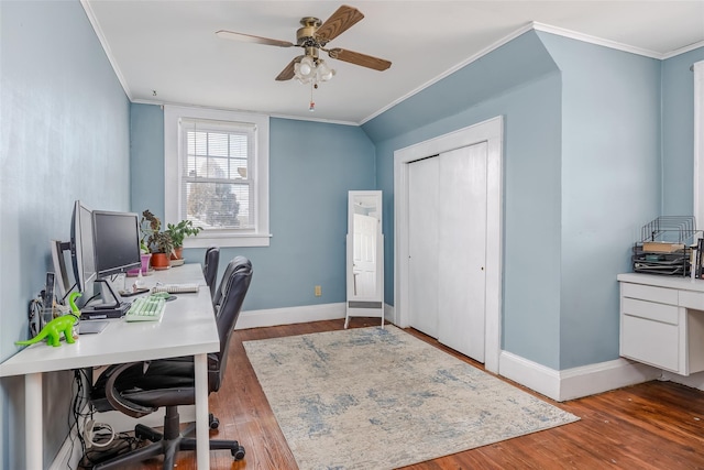 home office with ceiling fan, wood finished floors, baseboards, and ornamental molding