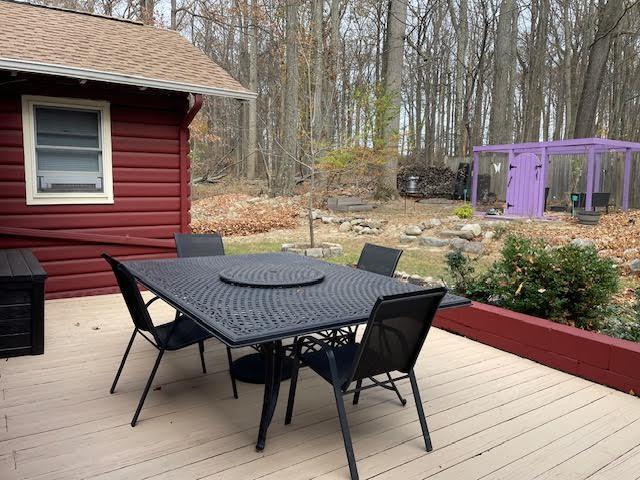 wooden deck with outdoor dining area