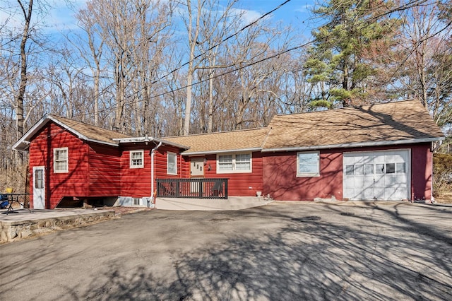 3 Rodman Pl, Spring Valley, NY 10977 - view of property exterior with driveway, a shingled roof, and an attached garage