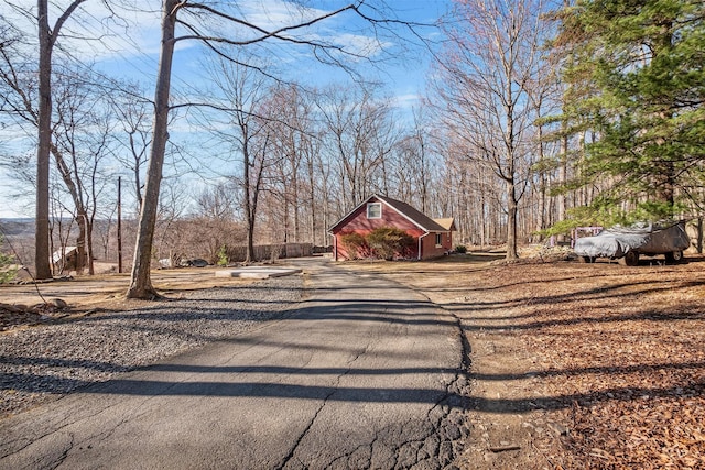 3 Rodman Pl, Spring Valley, NY 10977 - view of yard featuring a barn, an outbuilding, and asphalt driveway
