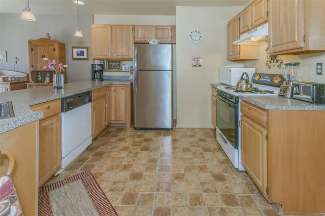 kitchen with white appliances, a peninsula, light countertops, under cabinet range hood, and pendant lighting