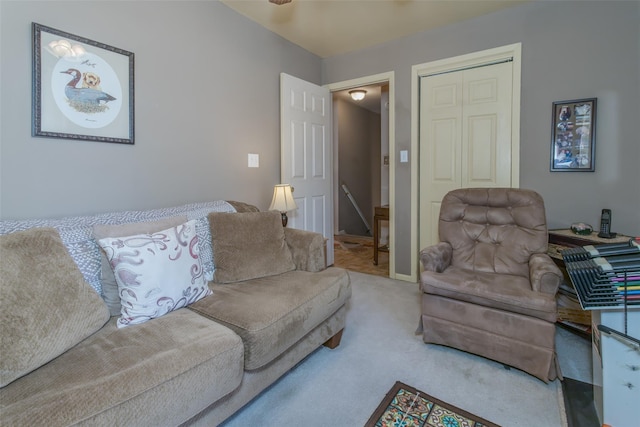 living room with carpet and baseboards