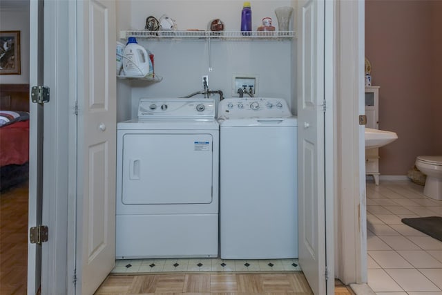 clothes washing area with laundry area and washing machine and dryer