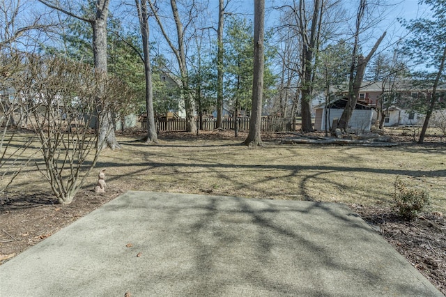 view of yard with a patio and fence