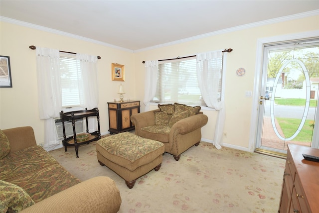 living room with baseboards, light colored carpet, and ornamental molding