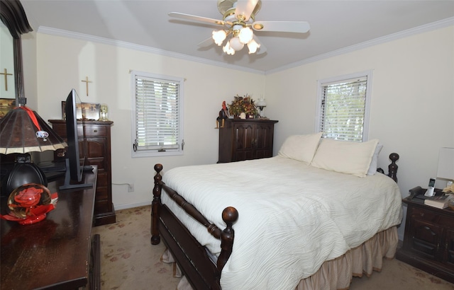 bedroom featuring crown molding, baseboards, light carpet, and a ceiling fan