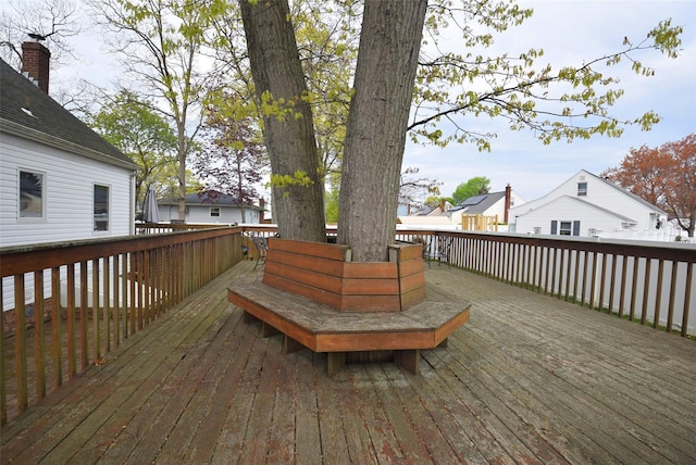 wooden terrace with a residential view