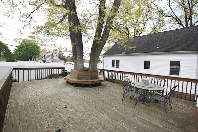 wooden terrace featuring outdoor dining space