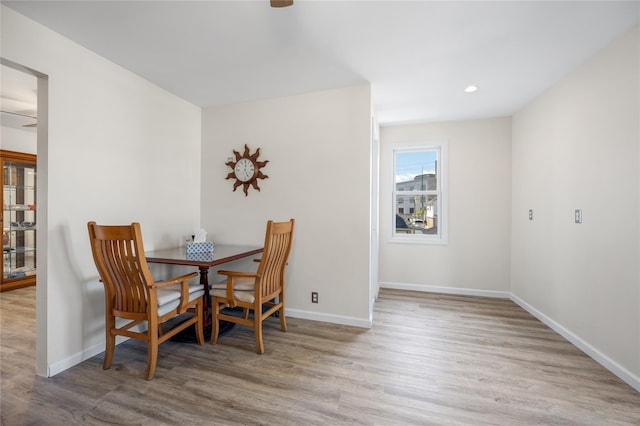 dining space featuring recessed lighting, baseboards, and wood finished floors