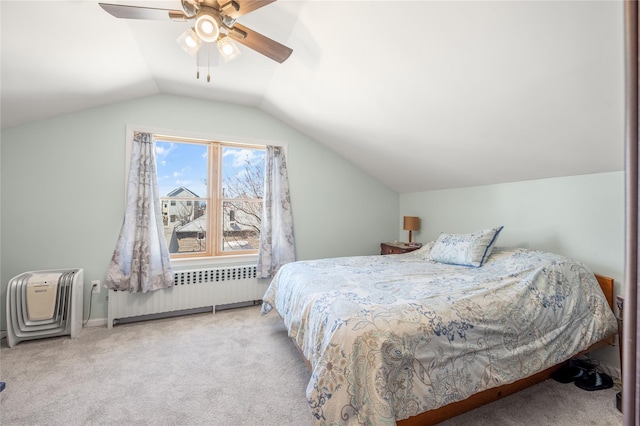 carpeted bedroom featuring lofted ceiling, radiator, and a ceiling fan