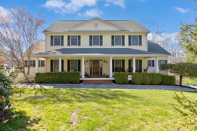 view of front of house featuring a porch and a front yard