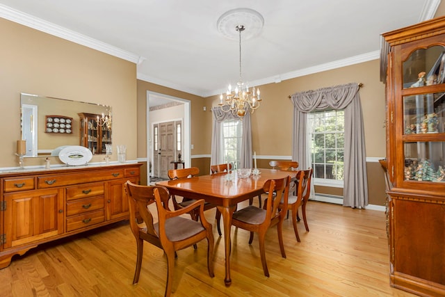 dining area with baseboard heating, a chandelier, crown molding, and light wood finished floors