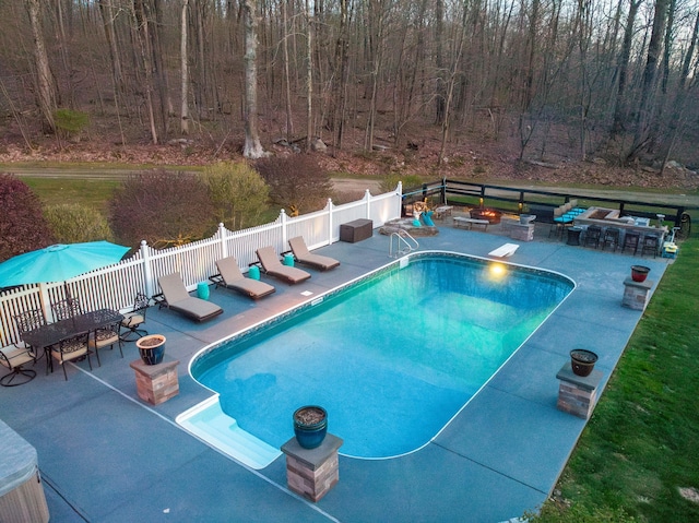 view of swimming pool with a patio area, a fenced in pool, an outdoor fire pit, and fence