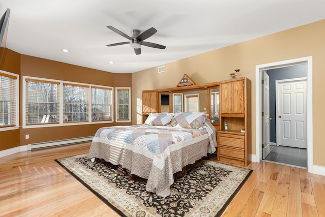 bedroom featuring visible vents, baseboards, recessed lighting, light wood-style floors, and a baseboard radiator