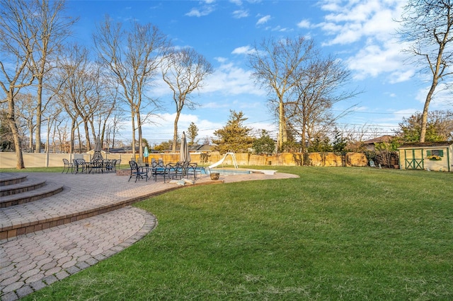 view of yard featuring a patio and fence