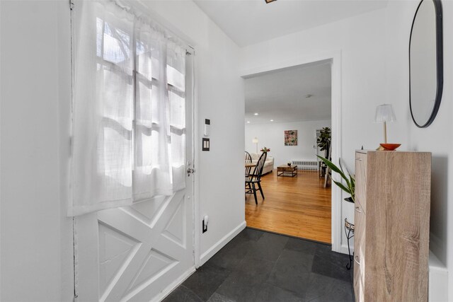 entryway featuring baseboards