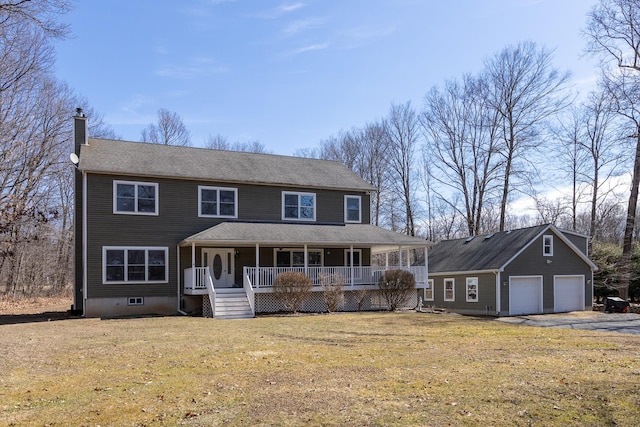 view of front facade featuring a garage, a chimney, covered porch, and a front lawn