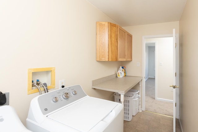 washroom featuring washer and dryer, baseboards, cabinet space, and light carpet