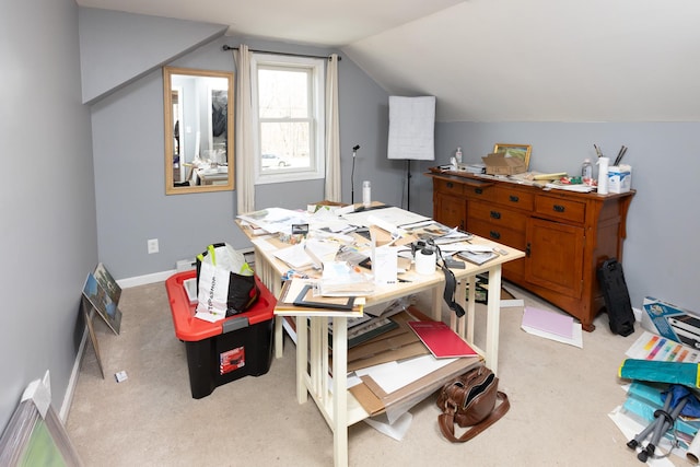 bedroom featuring lofted ceiling, baseboards, and light carpet