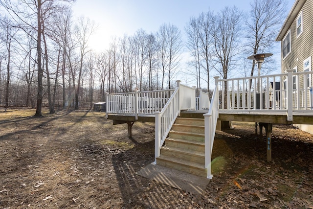 exterior space with stairway and a wooden deck