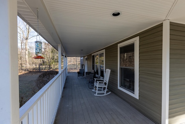 wooden terrace featuring a porch