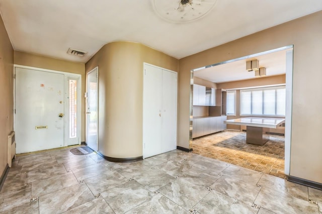 foyer featuring visible vents