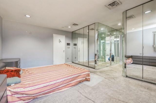 carpeted bedroom featuring visible vents and recessed lighting