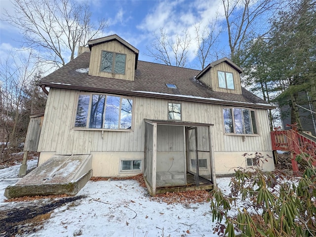 exterior space featuring a shingled roof