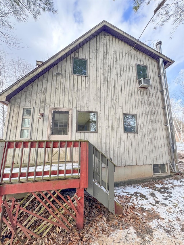 view of side of home featuring cooling unit and board and batten siding