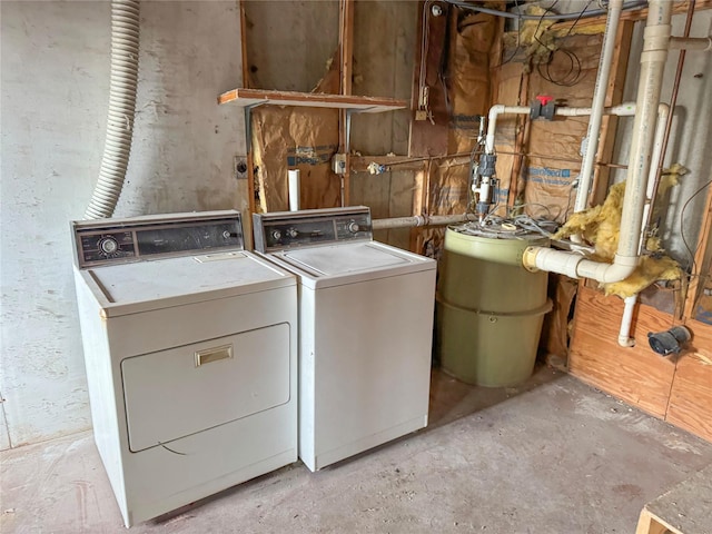 laundry room featuring separate washer and dryer and laundry area