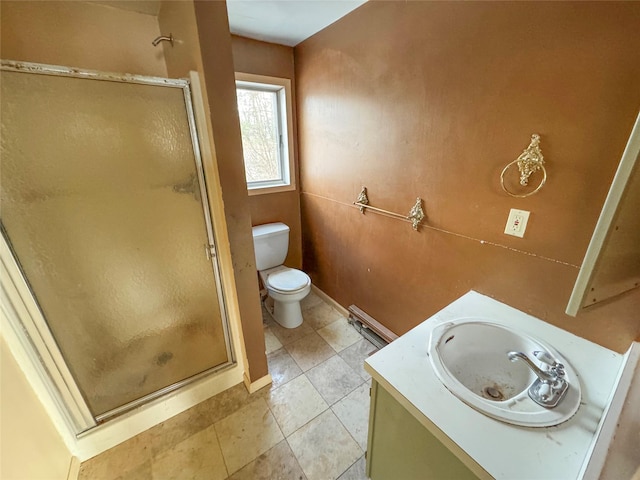 full bathroom featuring vanity, a shower stall, toilet, and tile patterned floors