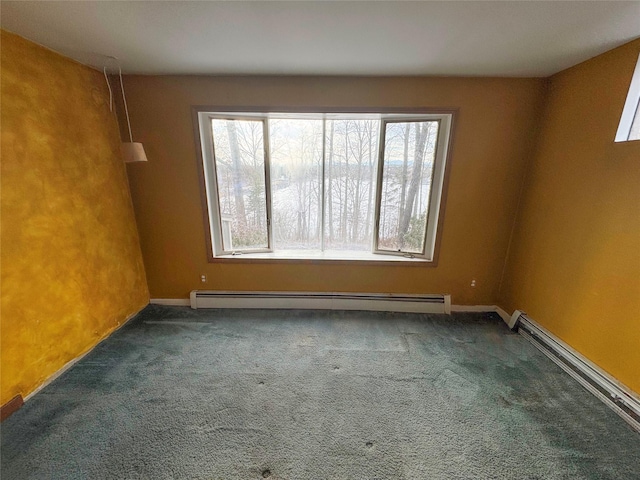 carpeted empty room with baseboards, baseboard heating, and a healthy amount of sunlight