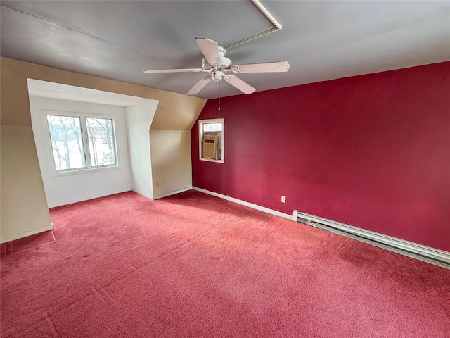 bonus room featuring carpet, baseboards, a ceiling fan, vaulted ceiling, and a baseboard heating unit