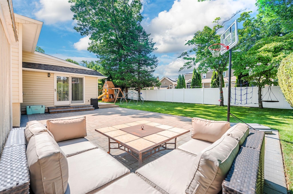 view of patio featuring entry steps, fence, outdoor lounge area, and a playground