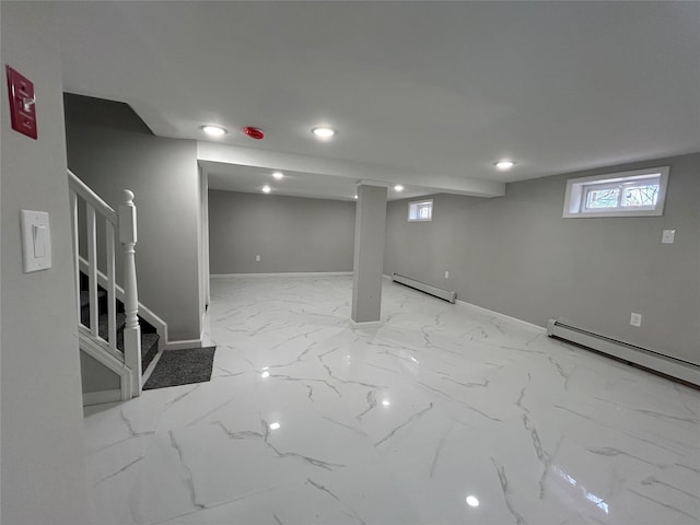 below grade area featuring stairway, baseboards, a baseboard radiator, a baseboard heating unit, and marble finish floor