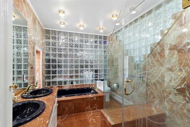 full bath featuring a sink, a bath, and ornamental molding