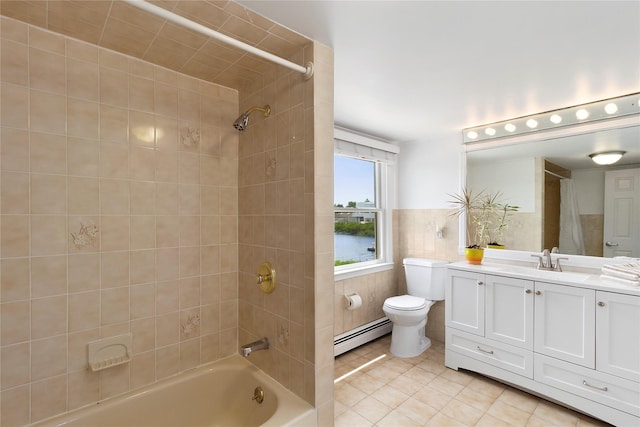 full bathroom with vanity, a baseboard radiator, shower / tub combo, tile patterned floors, and toilet