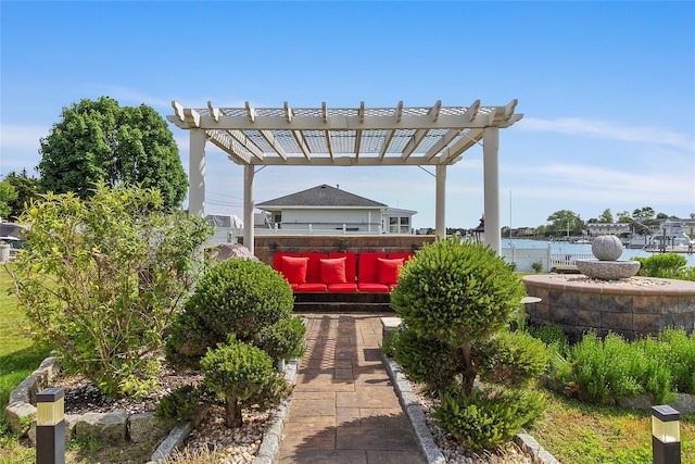 view of patio with an outdoor living space and a pergola