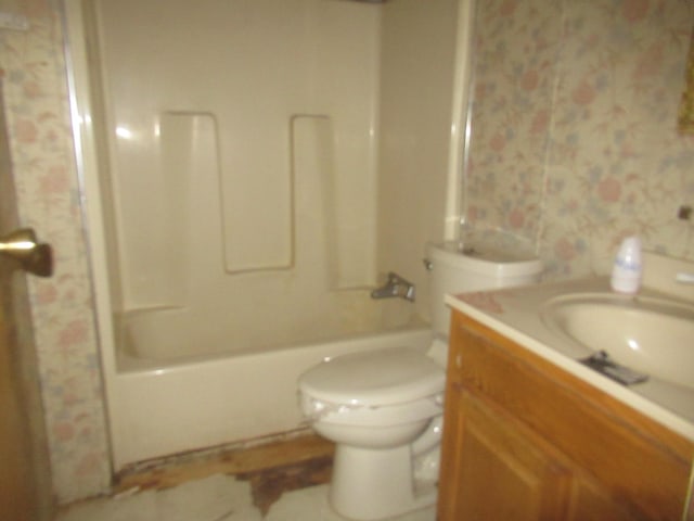 full bath featuring vanity,  shower combination, toilet, and wallpapered walls