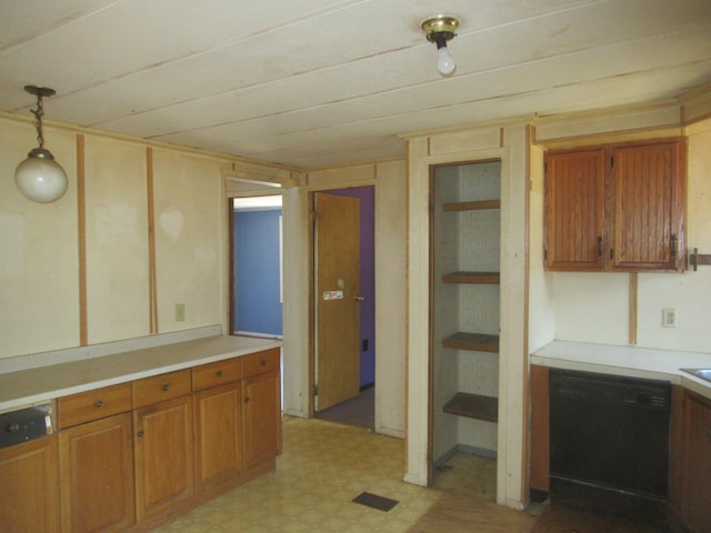 kitchen with brown cabinets, light floors, dishwasher, and light countertops