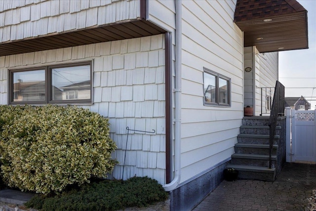 view of side of home with fence