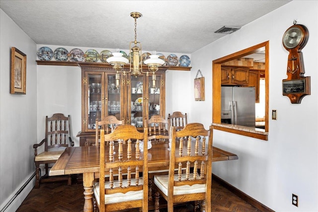 dining room featuring baseboards, visible vents, a textured ceiling, a baseboard heating unit, and a notable chandelier