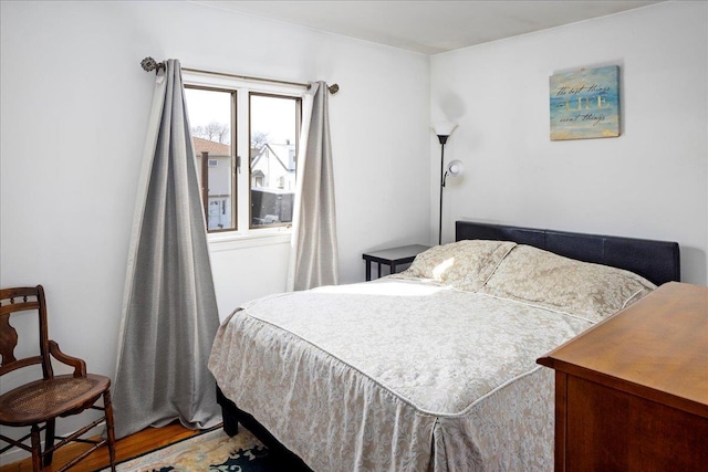 bedroom with wood finished floors