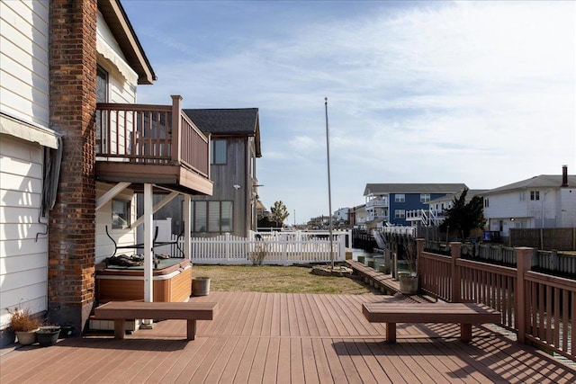 wooden deck featuring fence and a residential view