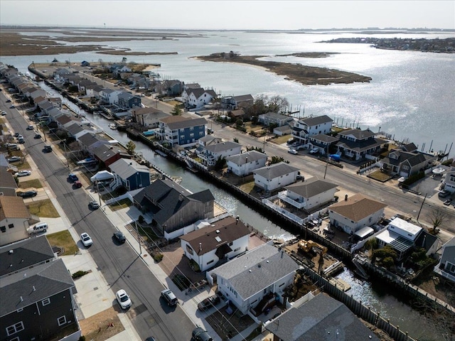 birds eye view of property with a residential view and a water view