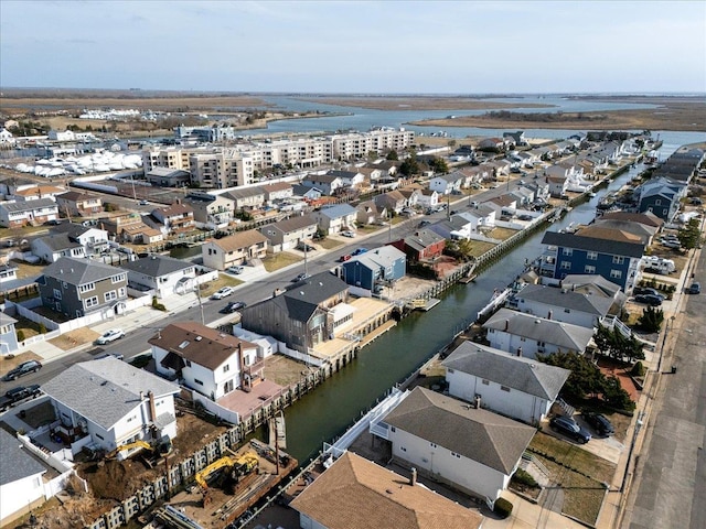 aerial view with a water view and a residential view