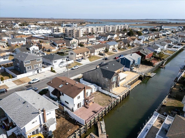 aerial view with a water view and a residential view