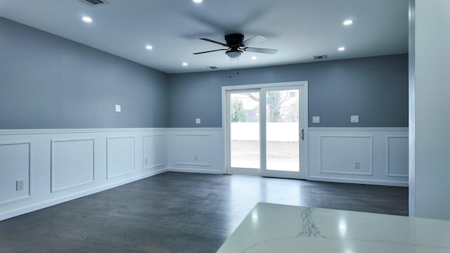 12 Meridian Rd, Levittown, NY 11756 - spare room featuring recessed lighting, wainscoting, dark wood finished floors, and a ceiling fan